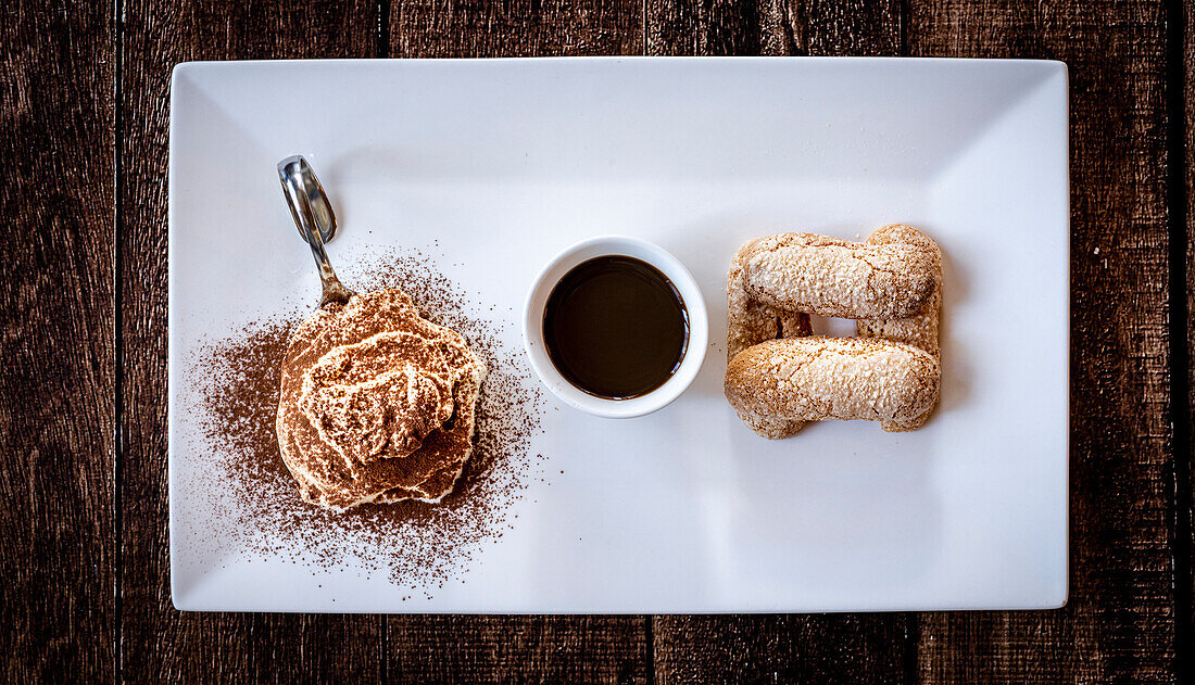 Tiramisu typical italian dessert and coffee cup from above