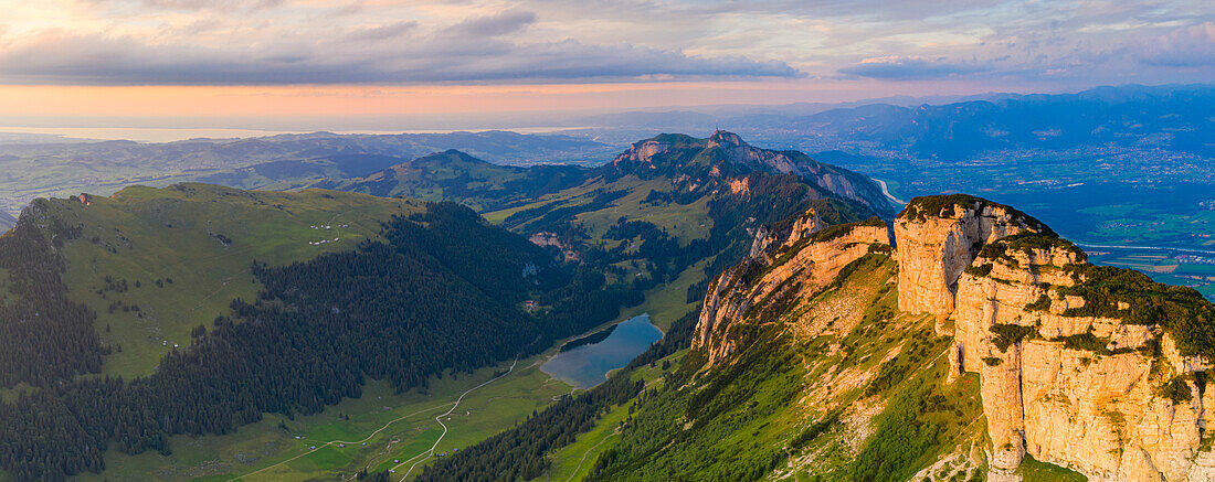 Sunset over Samtisersee lake, Staubern and Hoher Kasten mountains, aerial view, Appenzell Canton, Alpstein Range, Switzerland