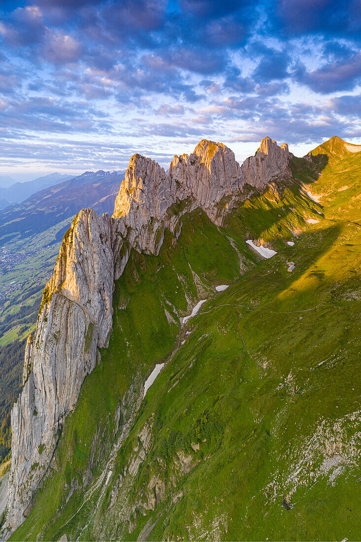 Clouds at dawn over the rocky peaks of Saxer Lucke, aerial view, Appenzell Canton, Alpstein Range, Switzerland