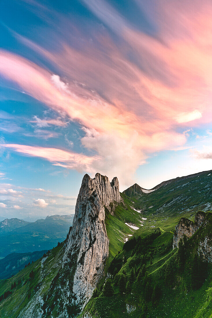 Pink clouds at sunset over Saxer Lucke mountain peak in summer, Appenzell Canton, Alpstein Range, Switzerland