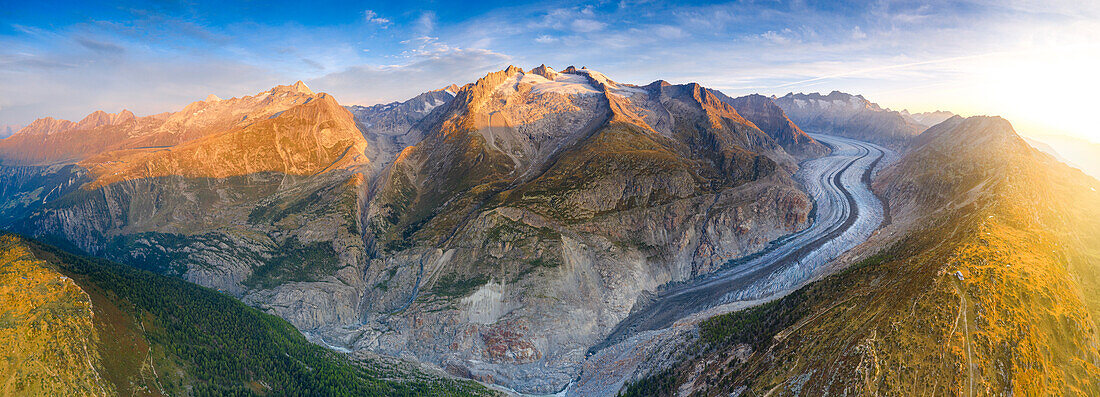 Aerial view of Aletsch Glacier and mountain peaks at sunrise, Bernese Alps, Valais canton, Switzerland