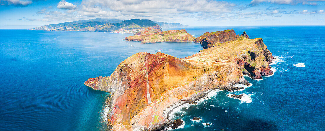 Aerial view of volcanic rock cliffs overlooking the blue ocean, Sao Lourenco Peninsula, Canical, Madeira island, Portugal