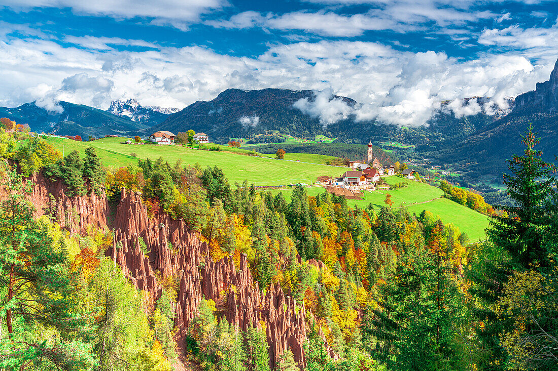 Earth pyramids natural rocks in the colorful alpine landscape in autumn, Longomoso, Renon/Ritten, Bolzano, South Tyrol, Italy
