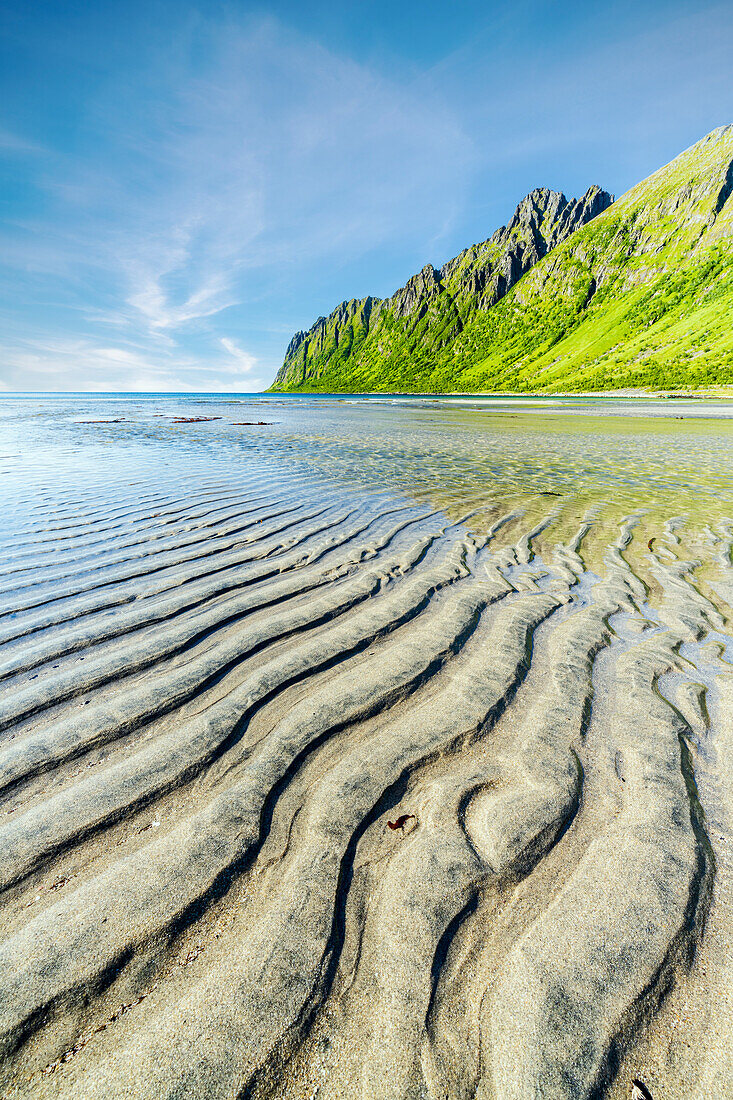 Sand shaped by wind on the large Ersfjord beach during the low tide, Senja, Troms county, Norway