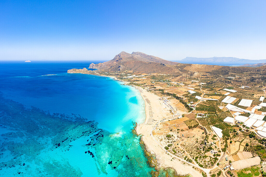 Aerial panoramic of mountains and crystal sea surrounding Falassarna beach, Kissamos, Chania, Crete, Greece