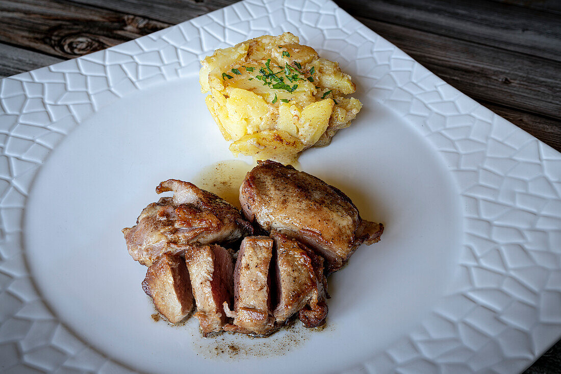 Sliced pork fillet with roasted potatoes, Italy