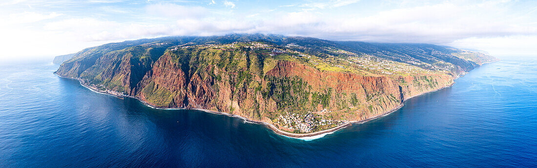 Aerial panoramic of Jardim do Mar tourist town on rocky coastline by the ocean, Madeira island, Portugal