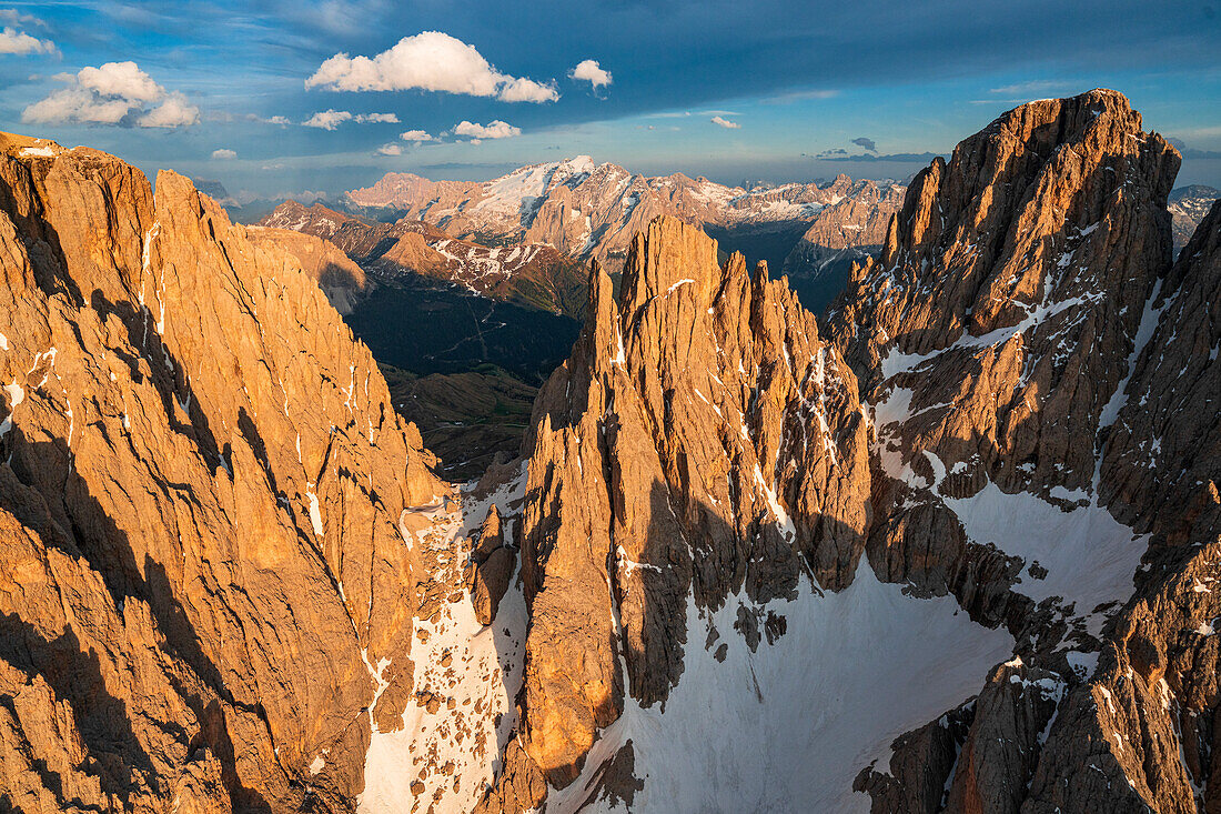 Aerial view of Sassolungo group Cinque Dita and Marmolada at sunset, Dolomites, South Tyrol, Italy