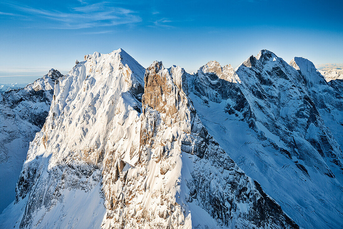 Aerial view of Sciore mountain range and snowcapped Pizzo Cengalo and Badile, Val Bondasca, Val Bregaglia, Switzerland