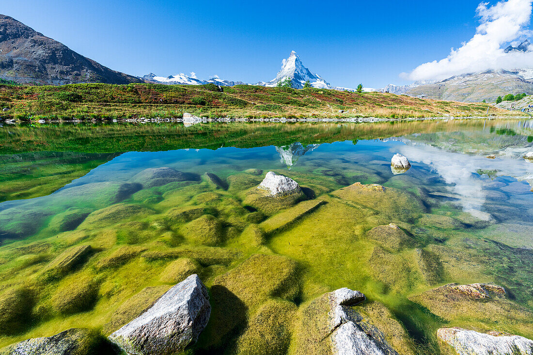 Matterhorn peak reflected in the emerald green water of lake Leisee, Sunnegga, Zermatt, canton of Valais, Switzerland