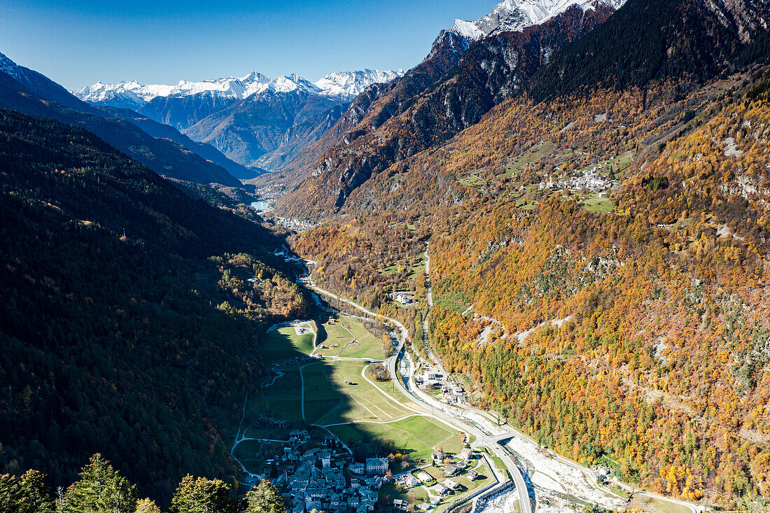 Aerial view of the alpine villages of Bondo and Castasegna framed by autumn woods, Val Bregaglia, Graubunden canton, Switzerland