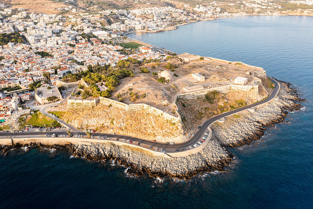 Aerial view of the old Fortezza, citadel on hilltop along the coastline, Rethymno, Crete island, Greece