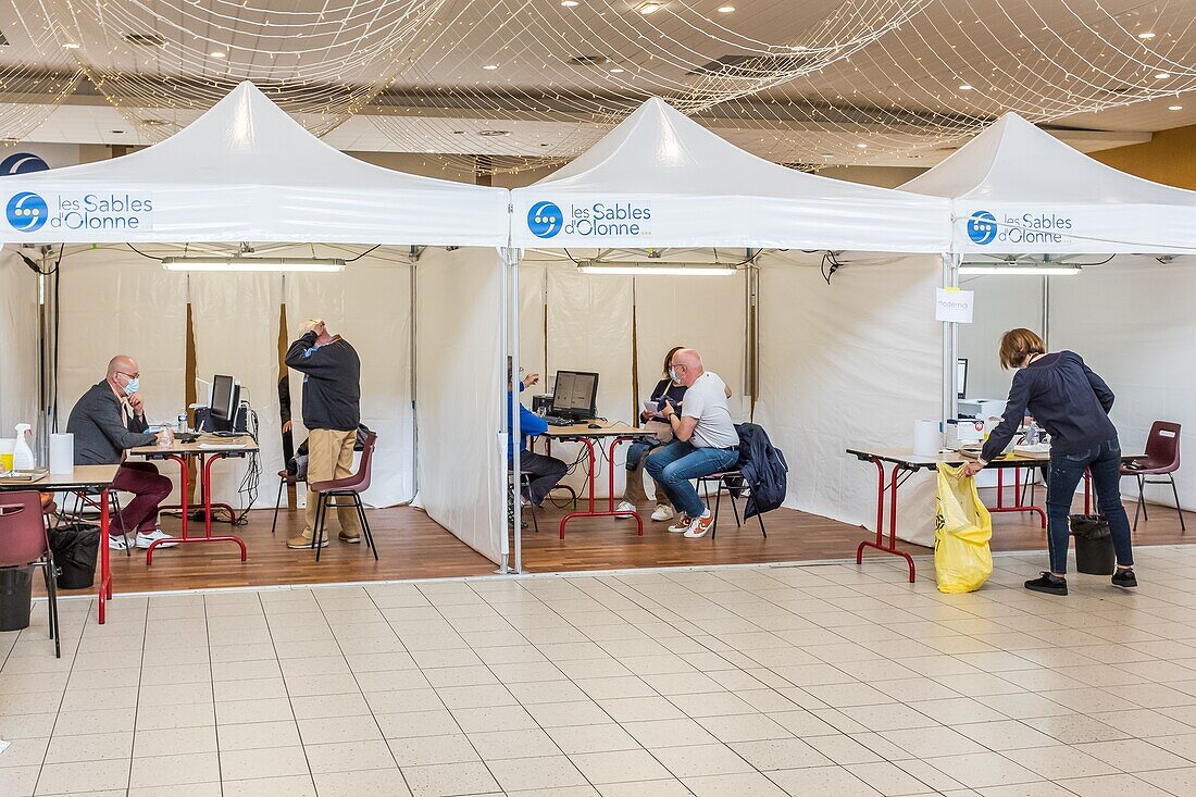 Meeting with a doctor before the inoculation, covid 19 vaccination center, gymnasium, les sables d'olonne, vendee, pays de loire, france, europe