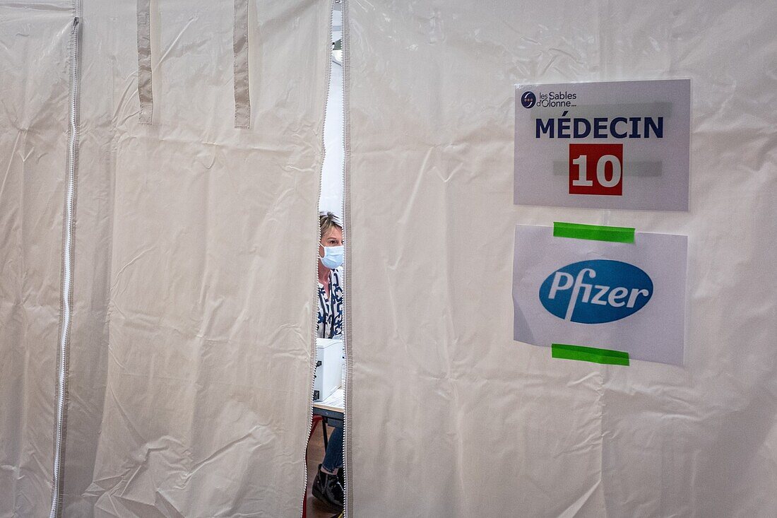 Meeting with a doctor before the inoculation, covid 19 vaccination center, gymnasium, les sables d'olonne, vendee, pays de loire, france, europe