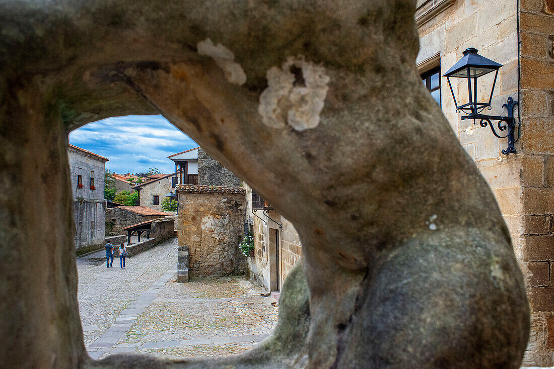 Past medieval buildings along cobbled street of Calle Del Canton in Santillana del Mar, Cantabria, Northern Spain