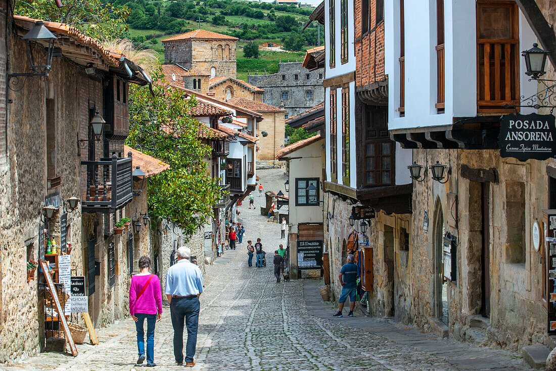 Past medieval buildings along cobbled street of Calle Del Canton in Santillana del Mar, Cantabria, Northern Spain