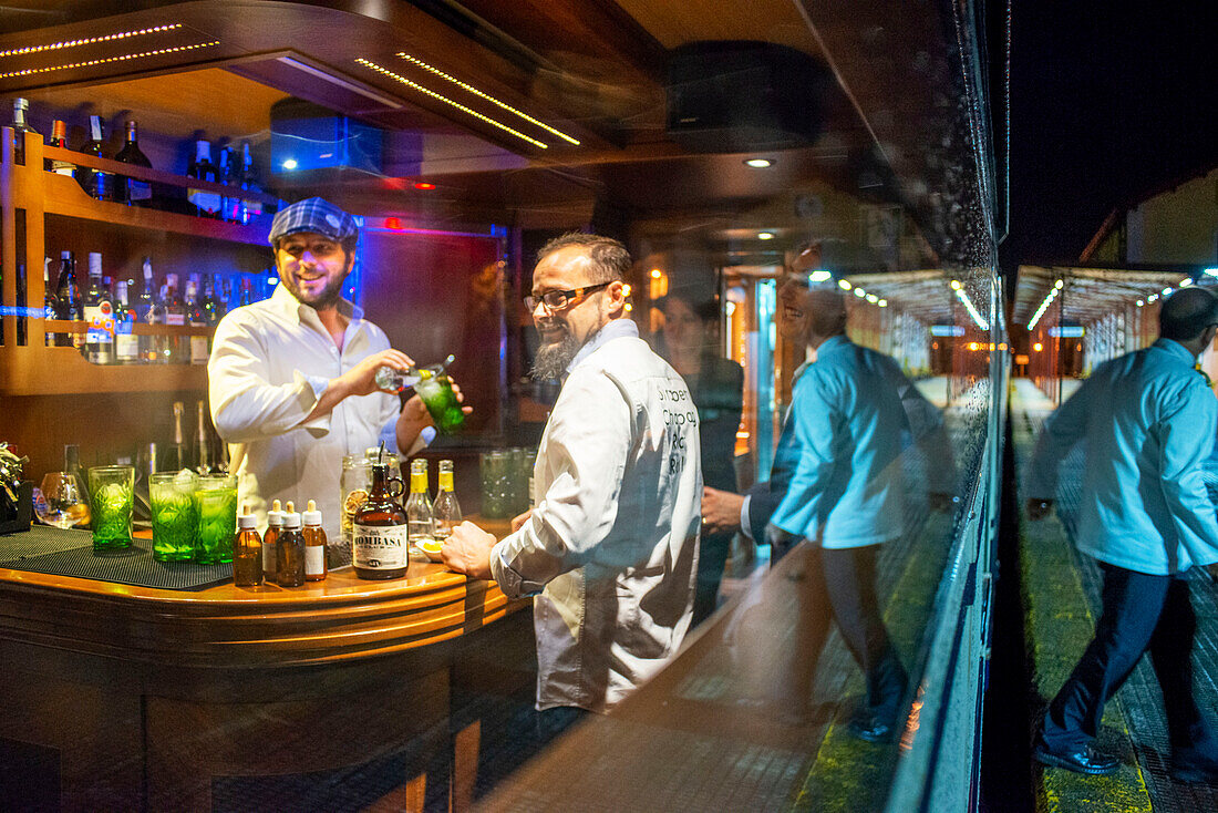 Inside of Transcantabrico Gran Lujo luxury train travellong across northern Spain, Europe. Interior of discotheque car. Gintonics tasting.