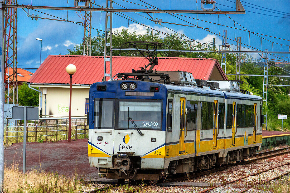 A passenger feve train arriving at Aviles RENFE railway station, Asturias, Spain