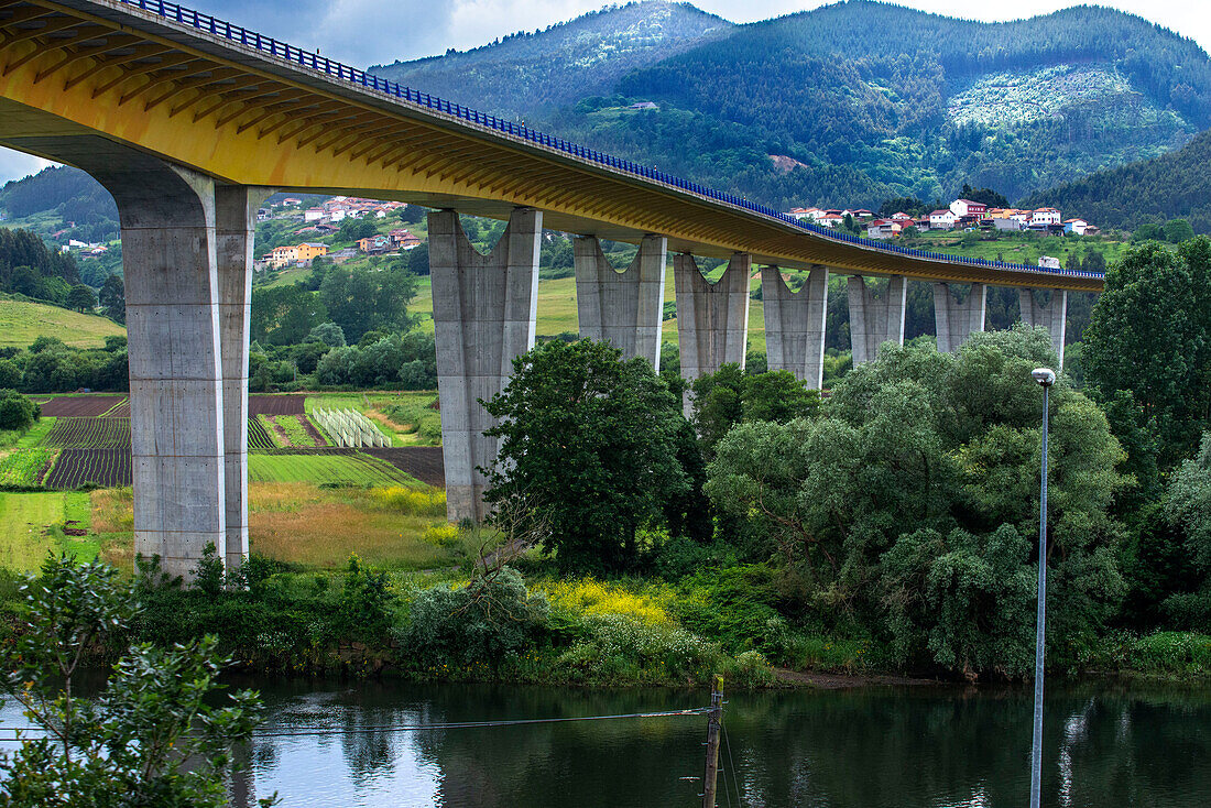 Viaduct between Luarca Asturias and Ribadeo in Galicia. Outisde carriages of Transcantabrico Gran Lujo luxury train travellong across northern Spain, Europe.