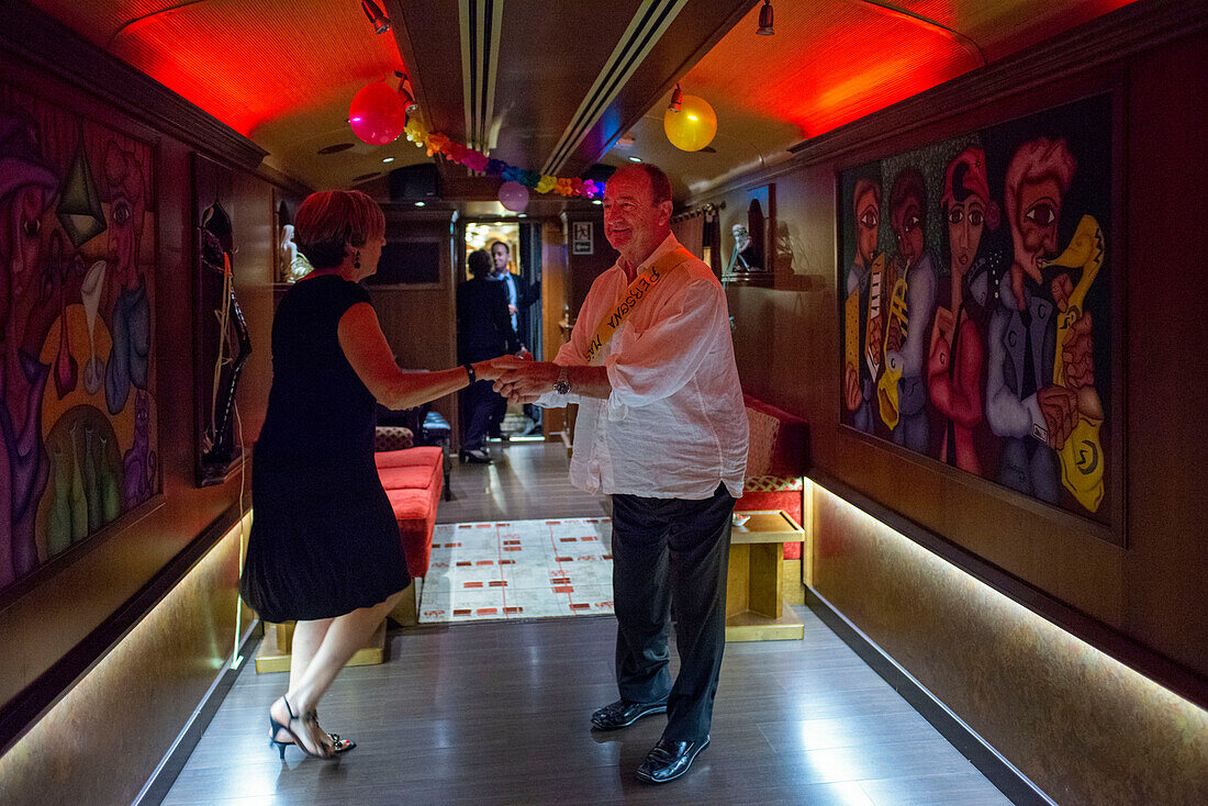 Inside of Transcantabrico Gran Lujo luxury train travellong across northern Spain, Europe. Interior of discotheque car. Party celebration.