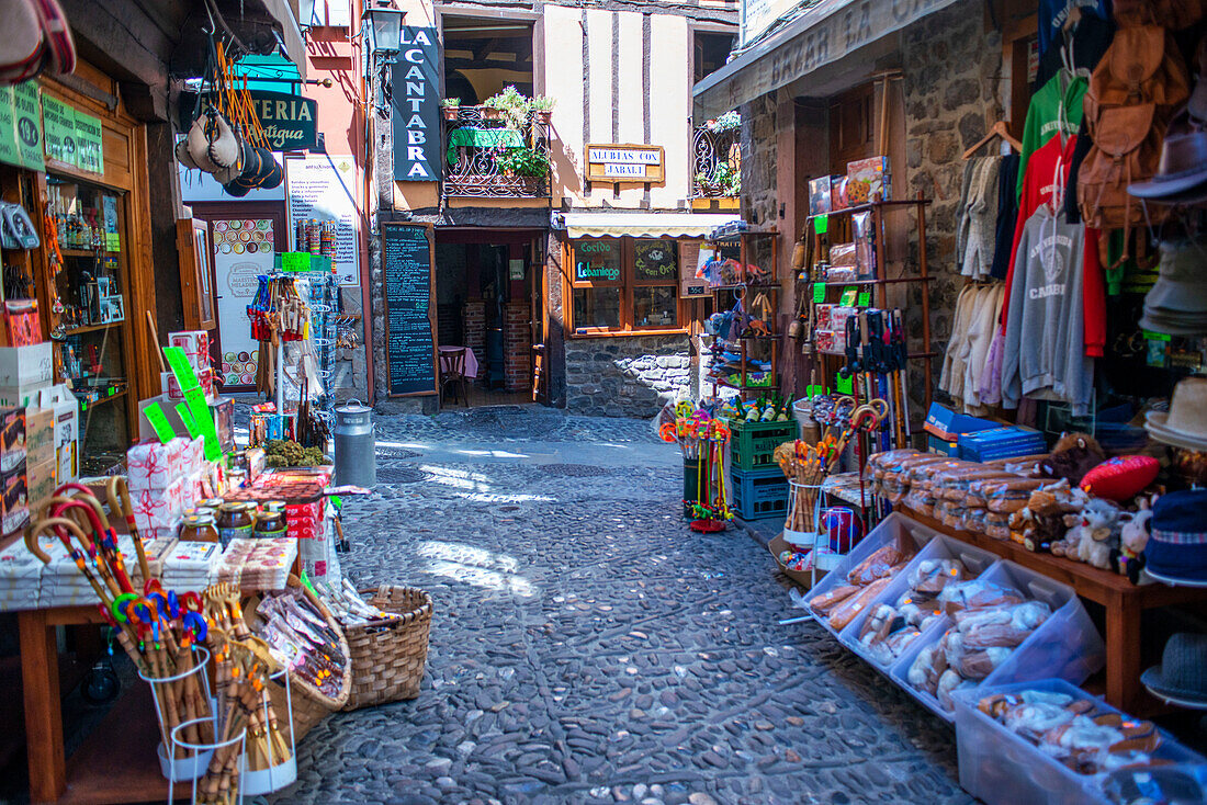 Souvenirs and handicrafts in Potes village hanging old buildings over the Rio Quiviesa, Potes, Picos de Europa Cantabria, Spain