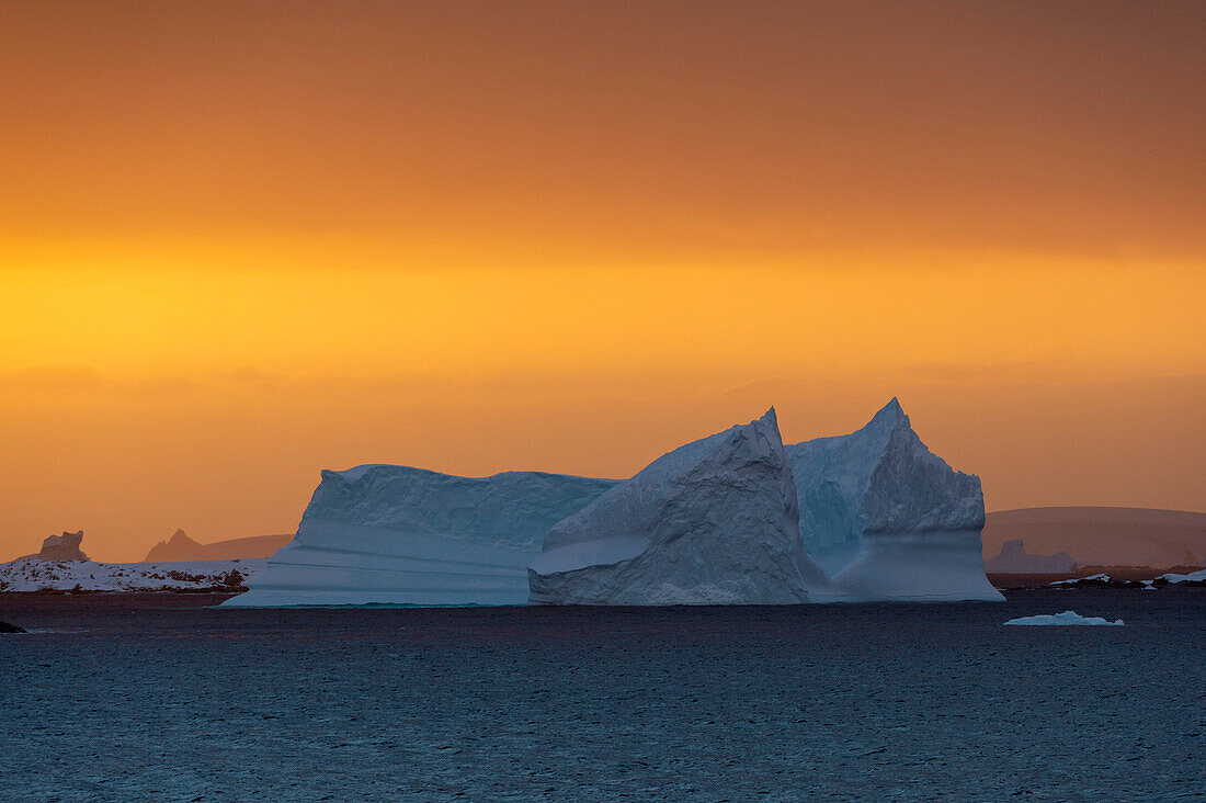 An iceberg at sunset in the Lemaire channel, Antarctica. Antarctica.