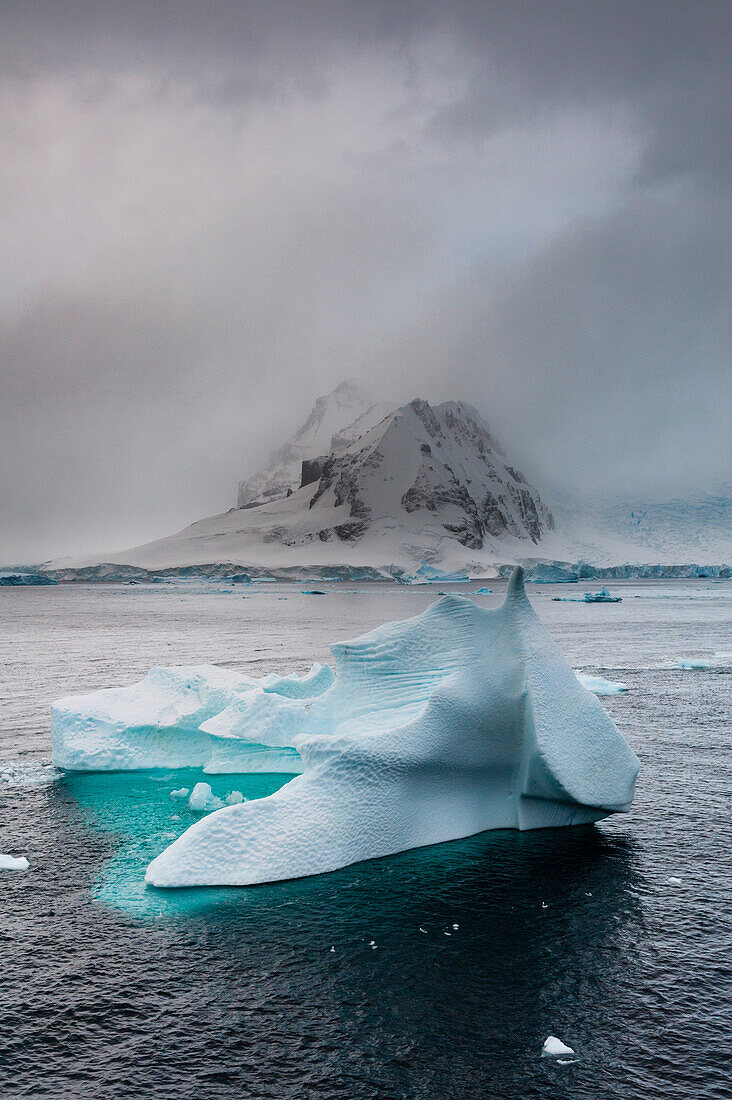An iceberg in the Herrera Channel, Antarctica. Antarctica.