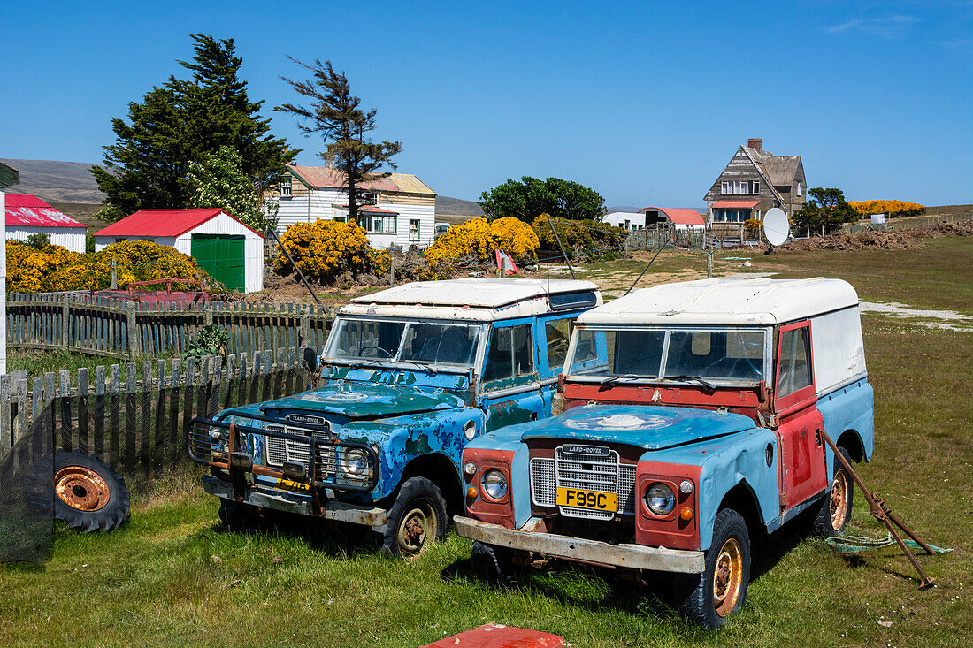 Land Rover vehicles in a settlement on the Falkland Islands. Falkland Islands.