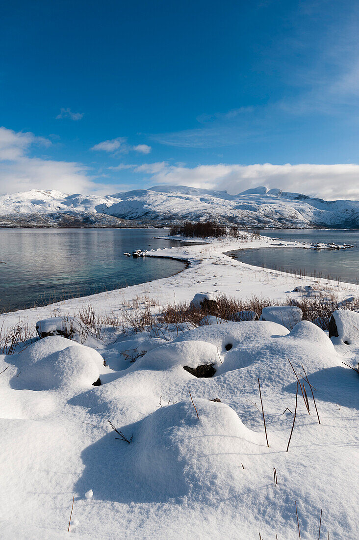 A scenic snowy fjord near Lodingen. Lodingen, Lofoten Islands, Nordland, Norway.