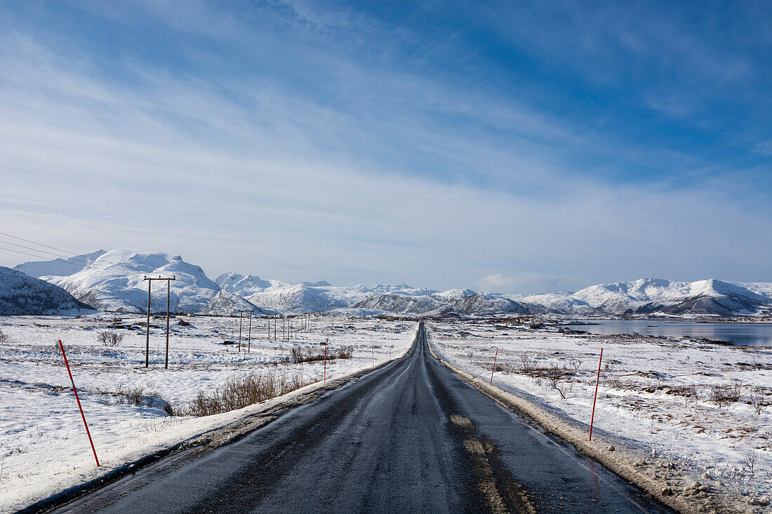 The National Tourist Road, Lofoten, through a snowy landscape. Vestvagoy, Lofoten Islands, Nordland, Norway.