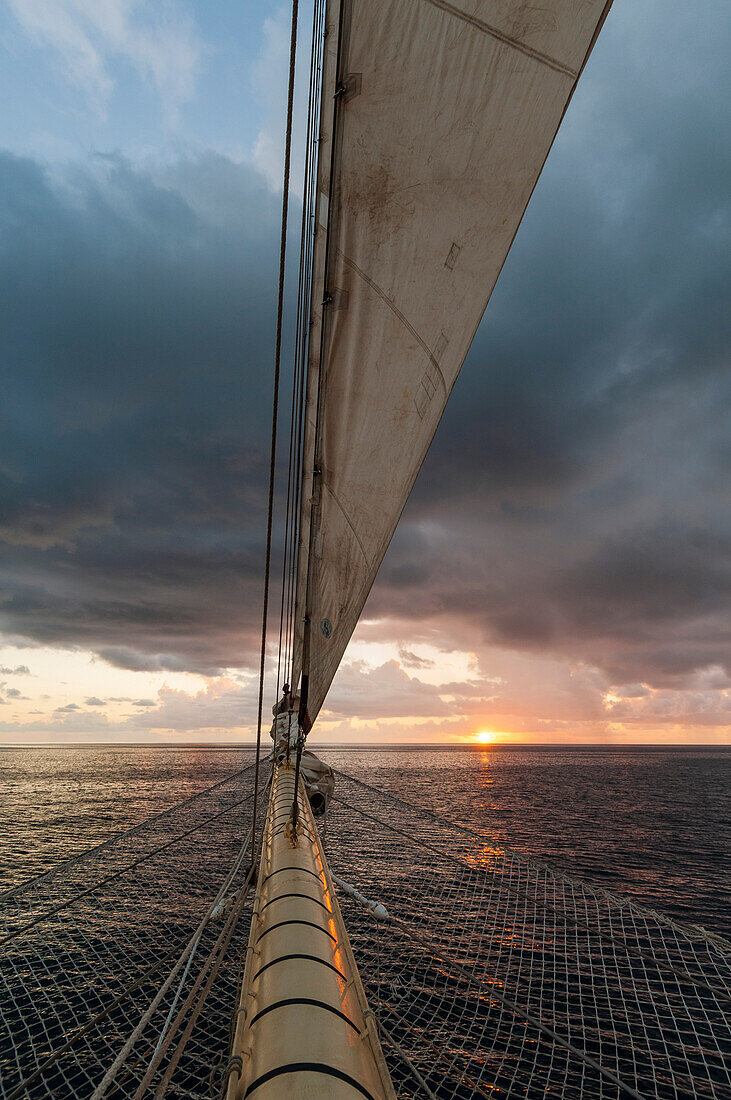 A view of the sunrise from the prow of a Star Clipper cruise ship sailing in the Caribbean near Nevis Island. Caribbean Sea near Nevis Island, West Indies.