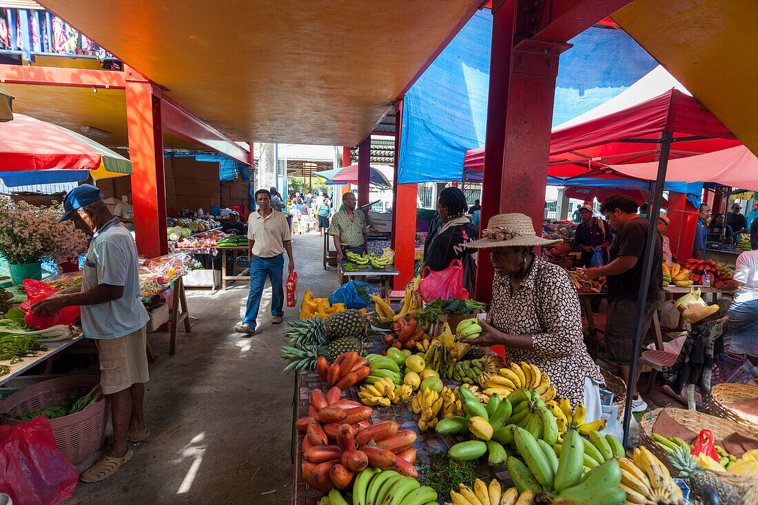 Locals shopping at the farmers' market in town. Victoria, Mahe Island, The Republic of the Seychelles.