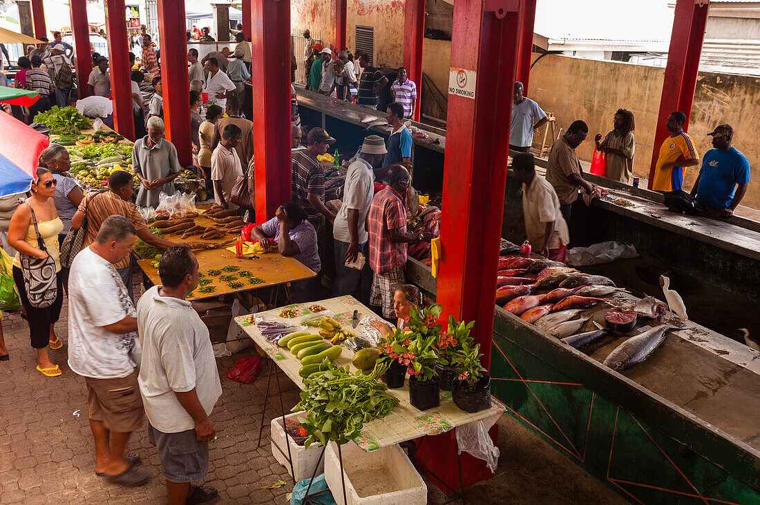 Locals shopping at the farmers' market in town. Victoria, Mahe Island, The Republic of the Seychelles.