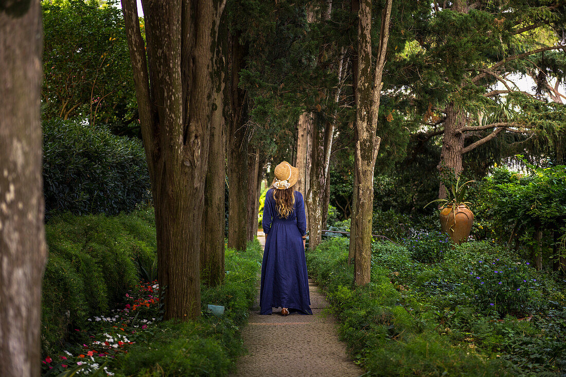 A girl walking in Villa San Michele garden, Capri island, Campania, Italy