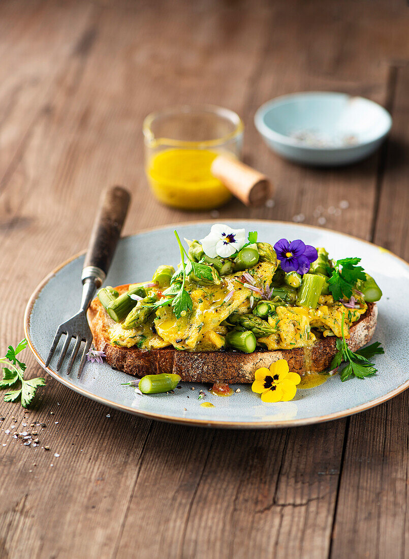 Asparagus and herb scrambled eggs on bread