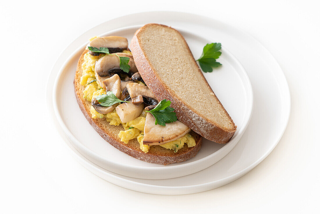 Scrambled egg and mushroom sandwich on sliced bread