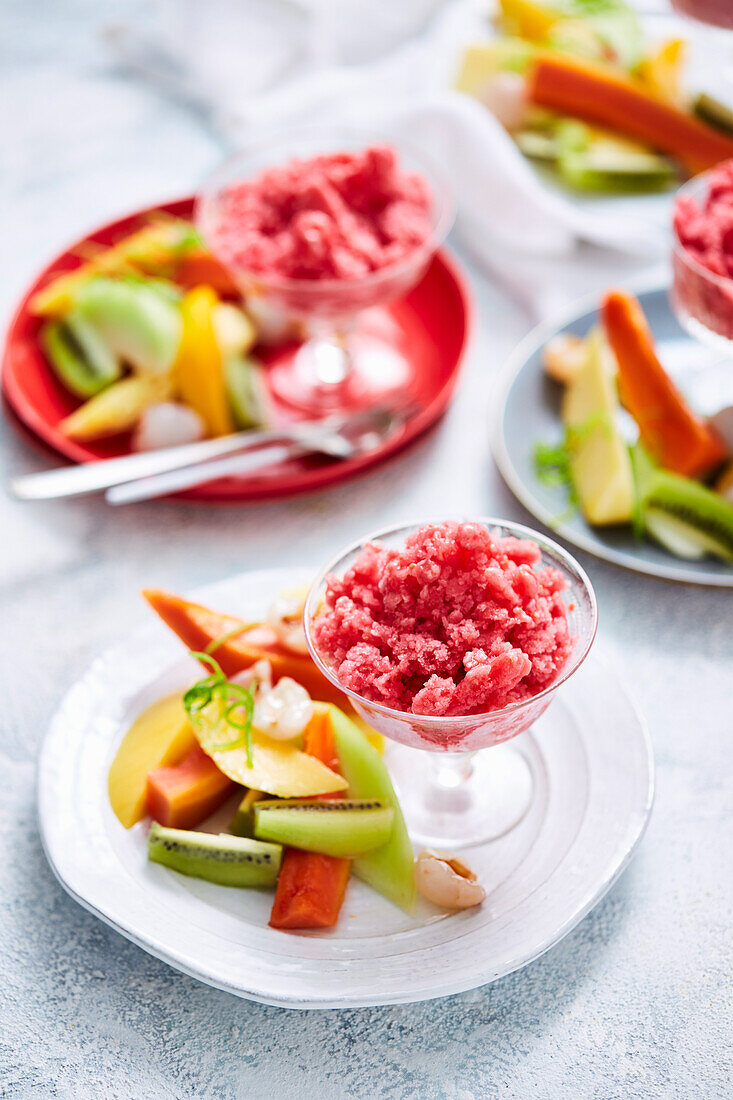 Rropical fruit salad with lychee berry granita