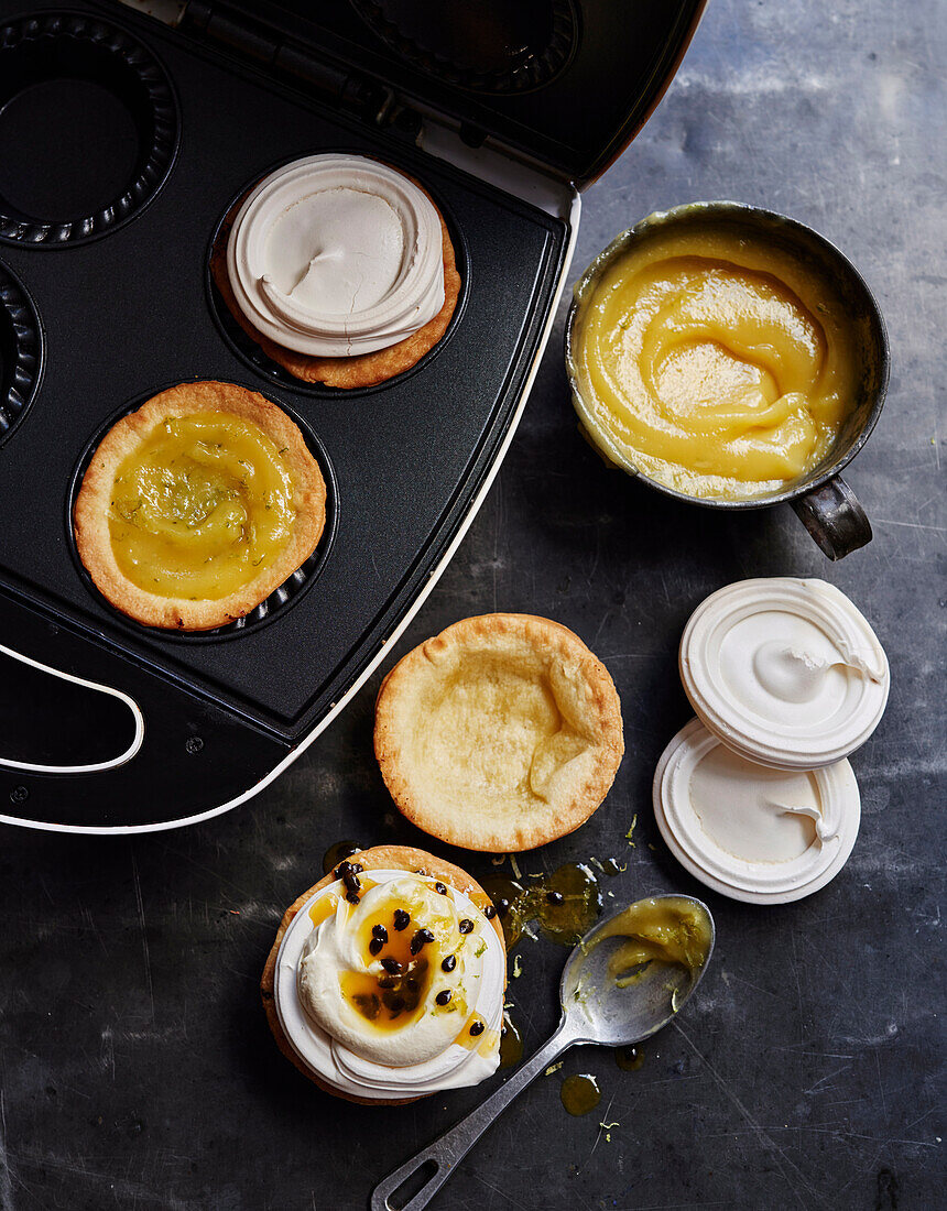 Lemon and lime meringue pies