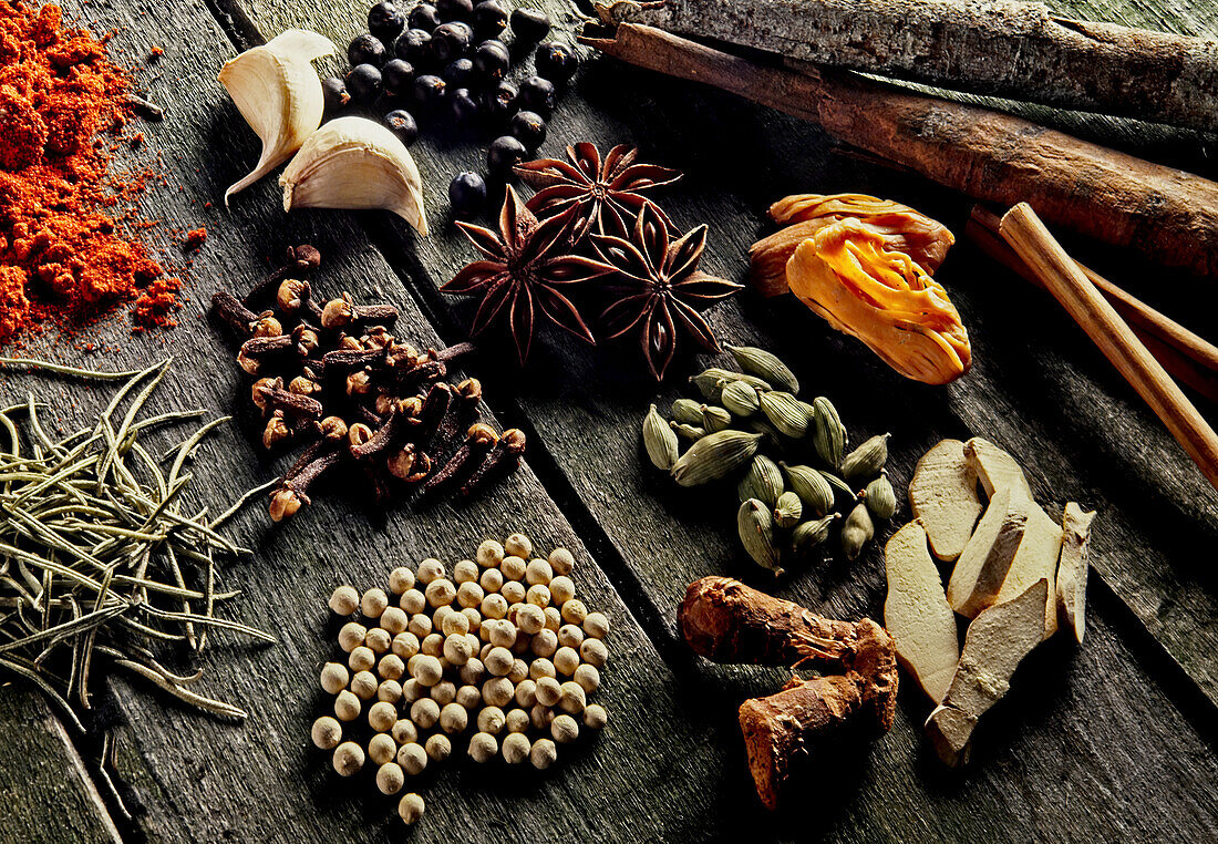 Various spices on a rustic wooden background