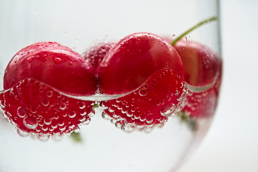 Cherries in a glass of water