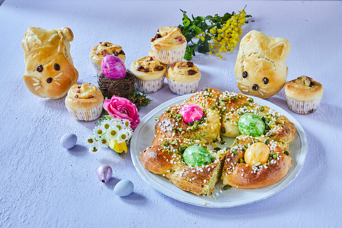 Yeast bread wreath with colored Easter eggs and yeast bread Easter bunnies