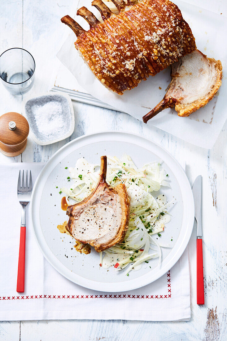 Crackling pork rack with apple fennel slaw