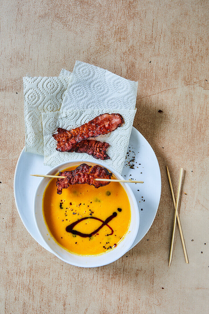 Carrot sweet potato soup with bacon skewers