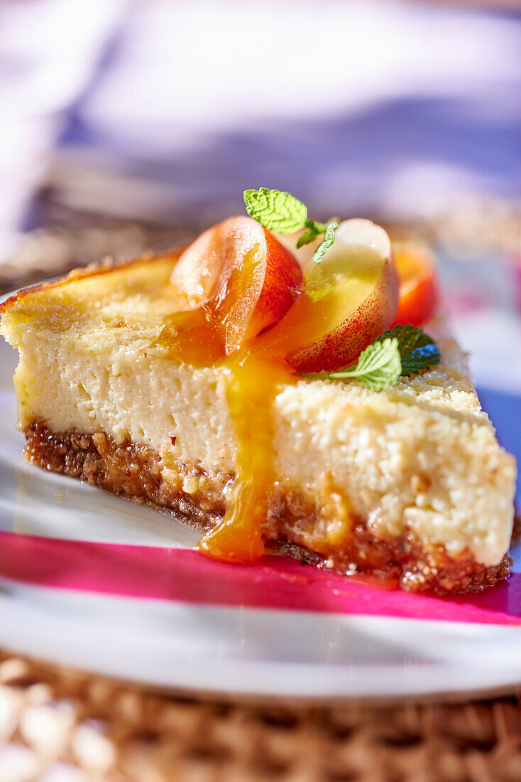 Cheesecake with peach and apricot sauce