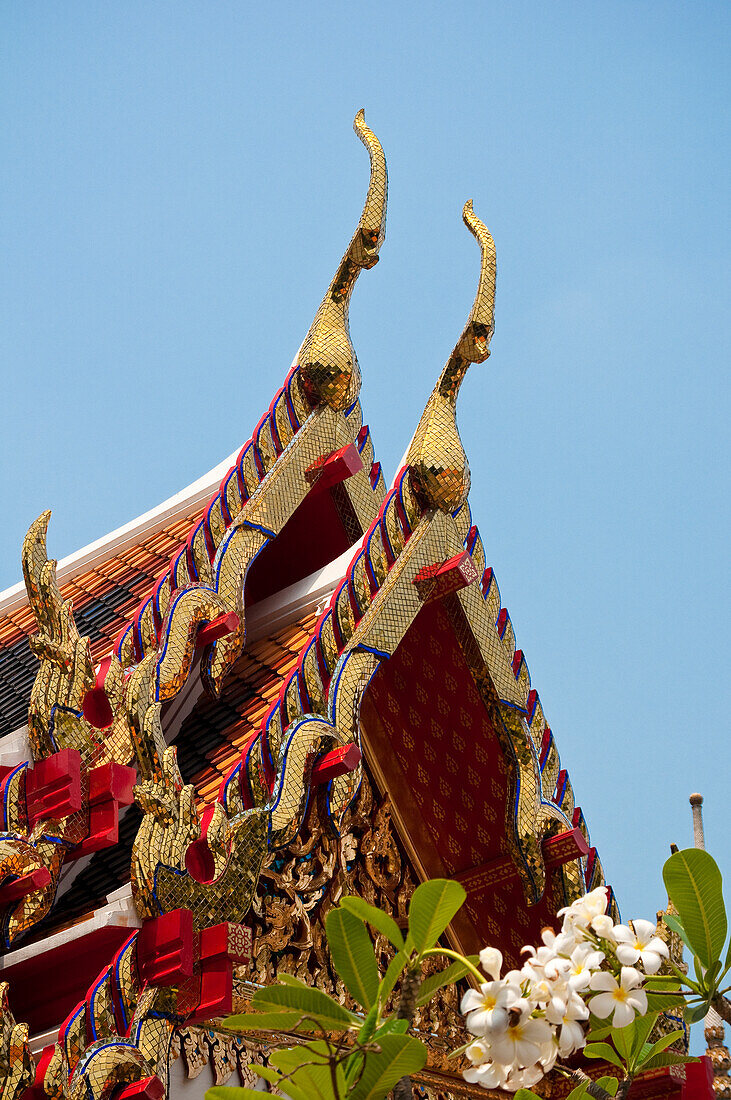 Tiered roof with cho fa finials on a viharn at Wat Pho Buddhist Temple, Bangkok, Thailand.