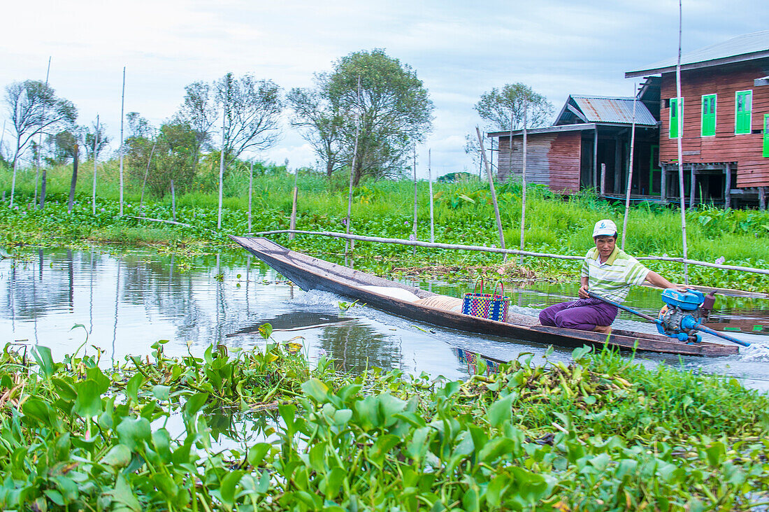 Intha man on his boat in Inle lake Myanmar on September 07 2017 , inle Lake is a freshwater lake located in Shan state