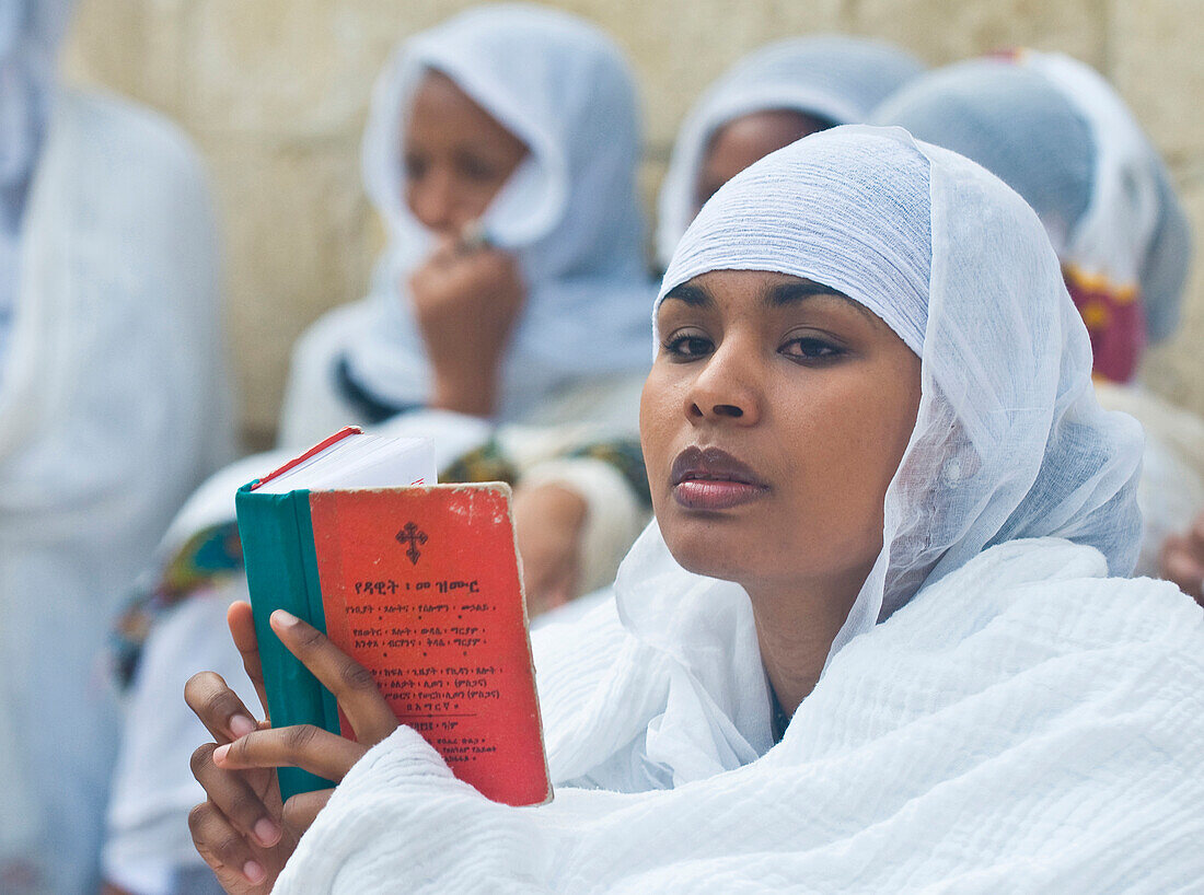 Ethiopian Orthodox worshipers await the start of the Holy fire ceremony at the Ethiopian section of the Holy Sepulcher in Jerusalm Israel