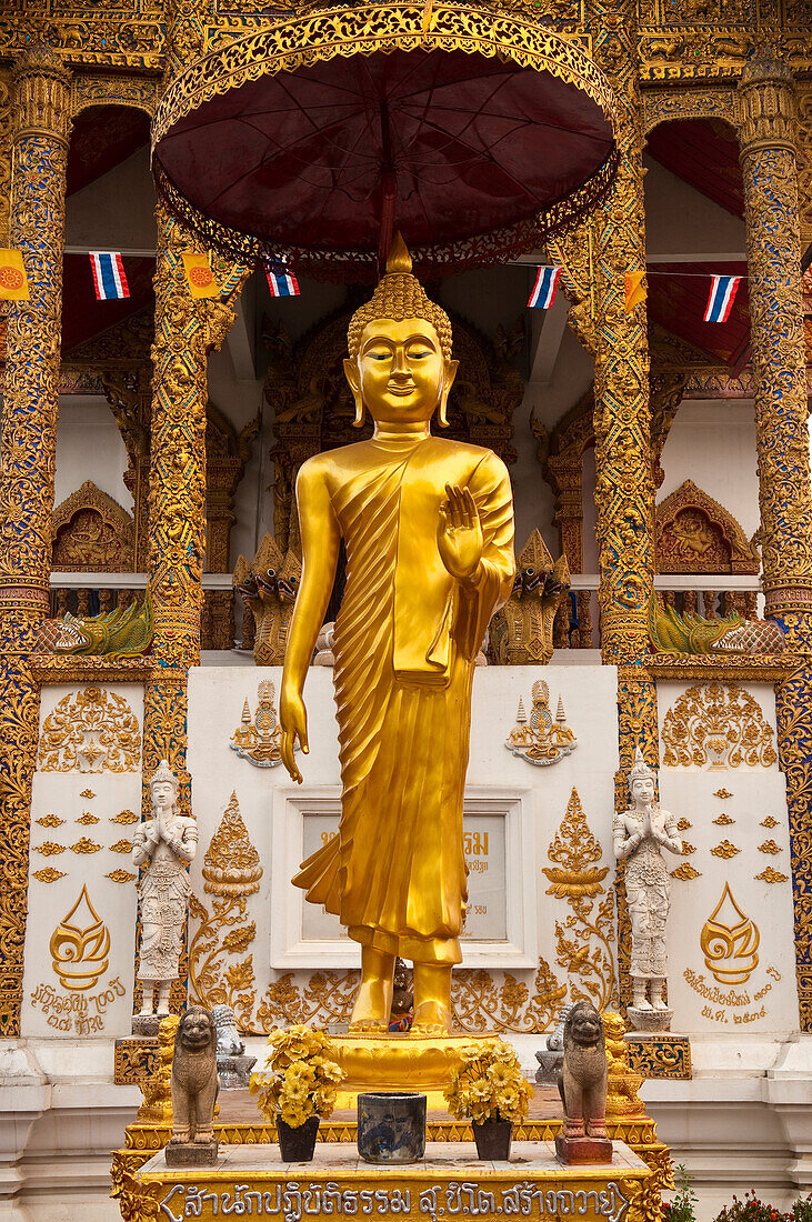 Buddha statue at Wat Bupparam Buddhist temple; Chiang Mai, Thailand.