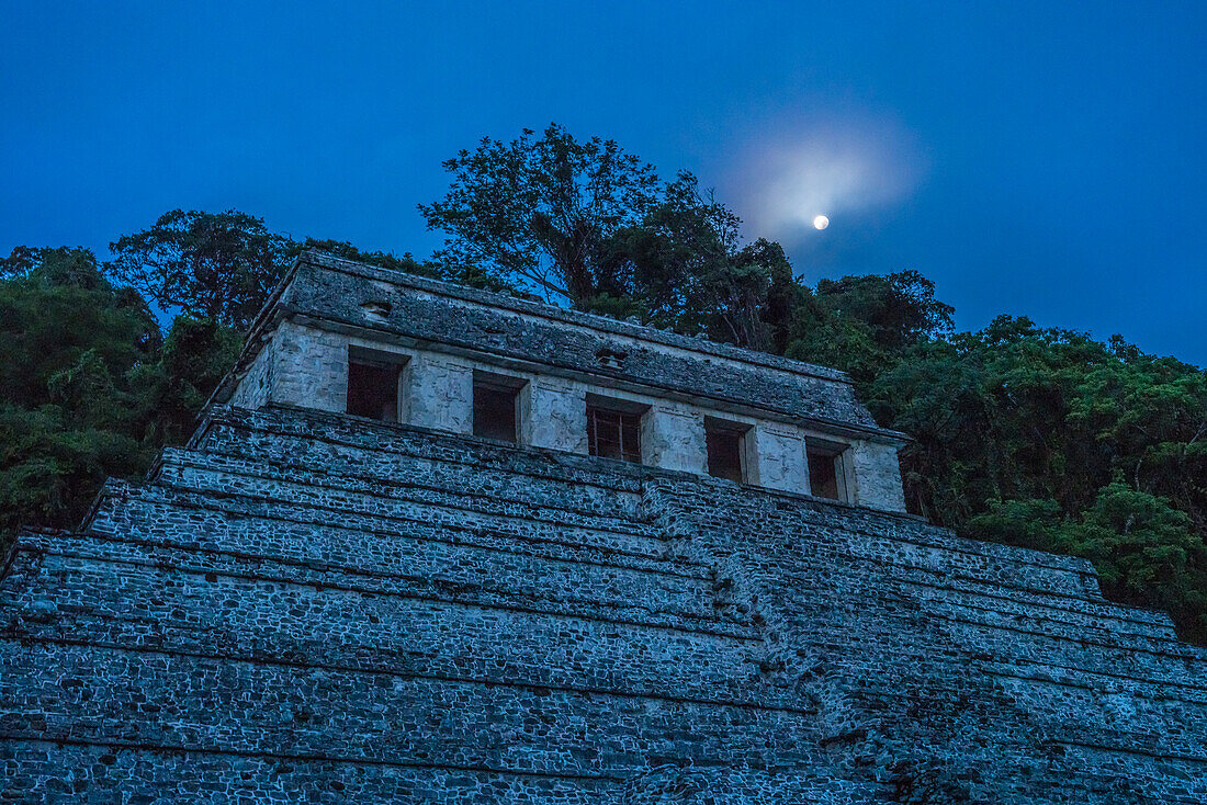 The Temple of the Inscriptions with the moon before dawn in the ruins of the Mayan city of Palenque, Palenque National Park, Chiapas, Mexico. A UNESCO World Heritage Site.