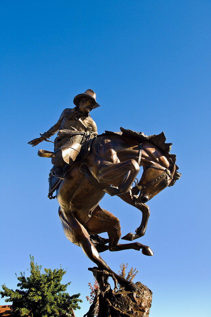 Bronze sculpture "Attitude Adjustment" by Austin Barton in front of City Hall in Joseph, Oregon.